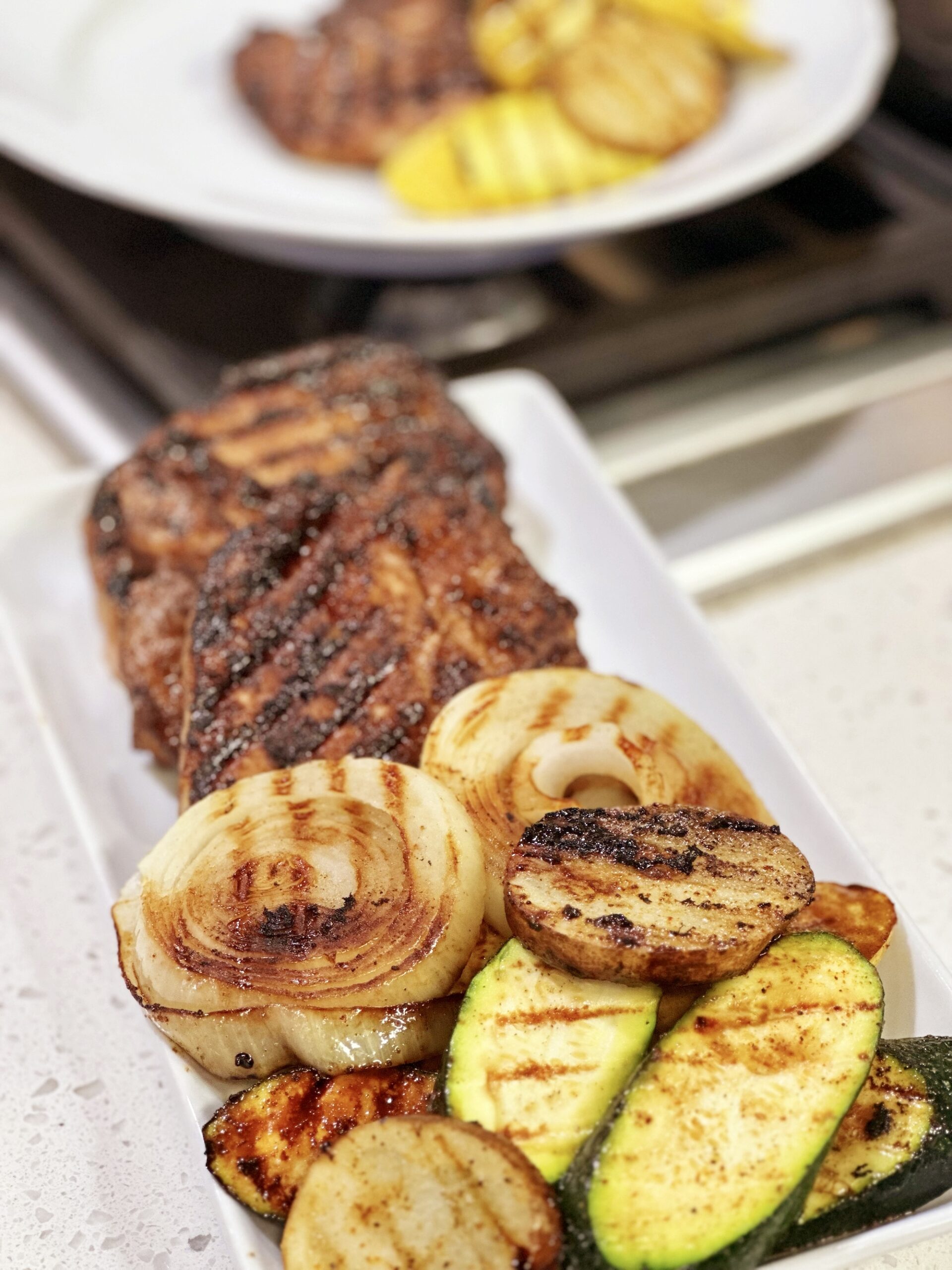 http://cookingwithchefbryan.com/wp-content/uploads/2023/05/Marinated-Grilled-Pork-Chops-with-Grilled-Vegetables-scaled.jpg