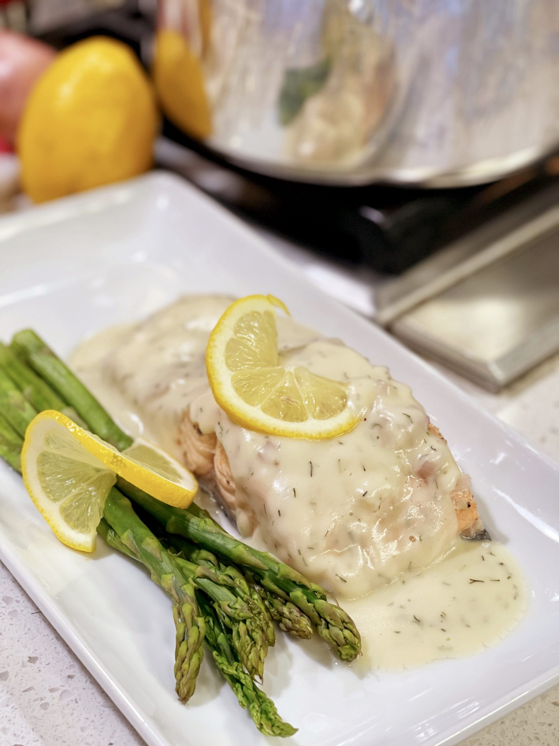 Shallow Poached bryan Lemon chef Salmon with a Veloute Sauce cooking with Dill 
