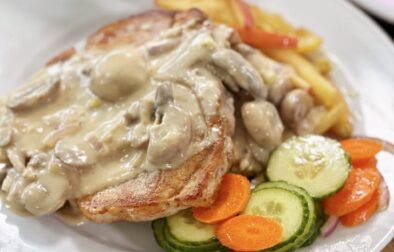 Pan Seared Pork Chop with Mushroom Dijon Gravy, Cinnamon Apples and a Cucumber Carrot Salad