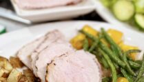 Pork Loin with Sautéed Green Beans and Bell Peppers, Roasted Potatoes, and Fresh Lettuce Salad