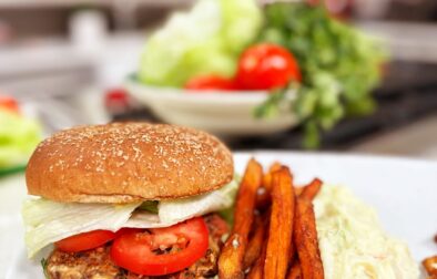 Flavorful Black Bean Burgers with Avocado Crema & Sweet Potato Fries