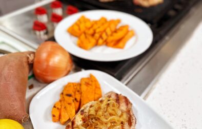 Grilled Pork Chops with Sweet Caramelized Onions, Smoky Sweet Potato Wedges, and Zesty Green Beans
