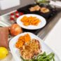 Grilled Pork Chops with Sweet Caramelized Onions, Smoky Sweet Potato Wedges, and Zesty Green Beans
