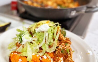 Chicken Tinga Stuffed Sweet Potatoes with Lime Crema